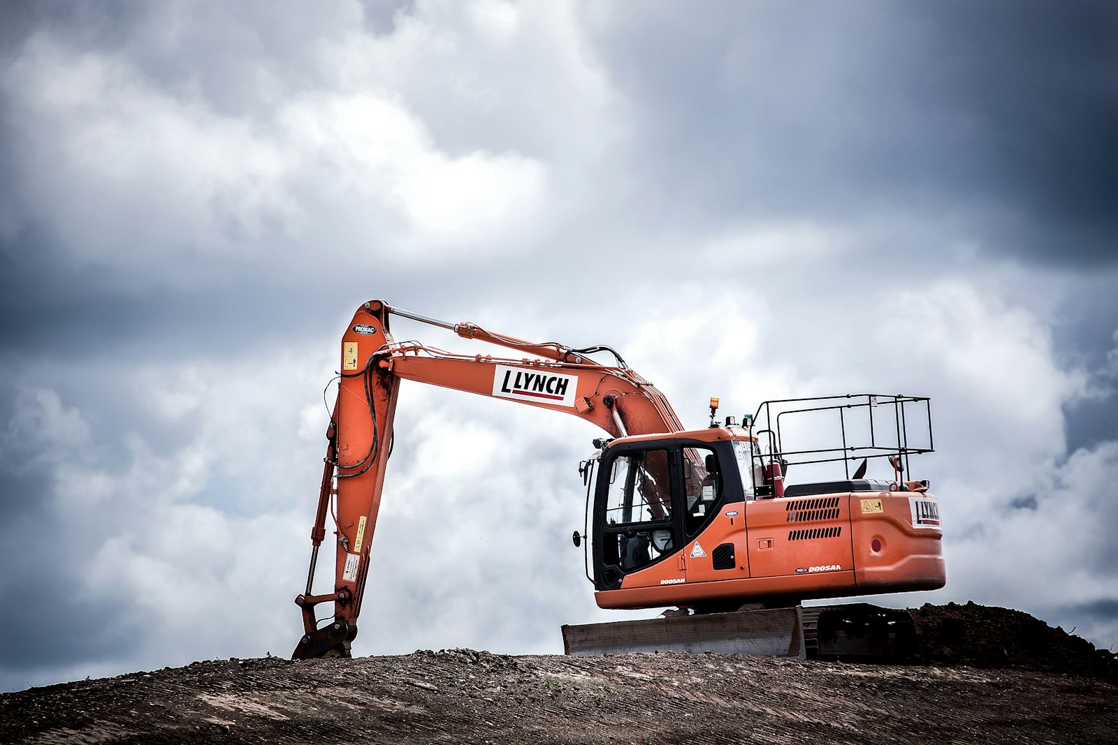 Photo by Luke Besley orange excavator